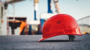 A worker's hard hat in a construction zone