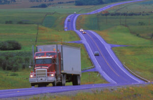 Liability Of Trucking Company For A Truck Accident. Semi-Truck on the highway.