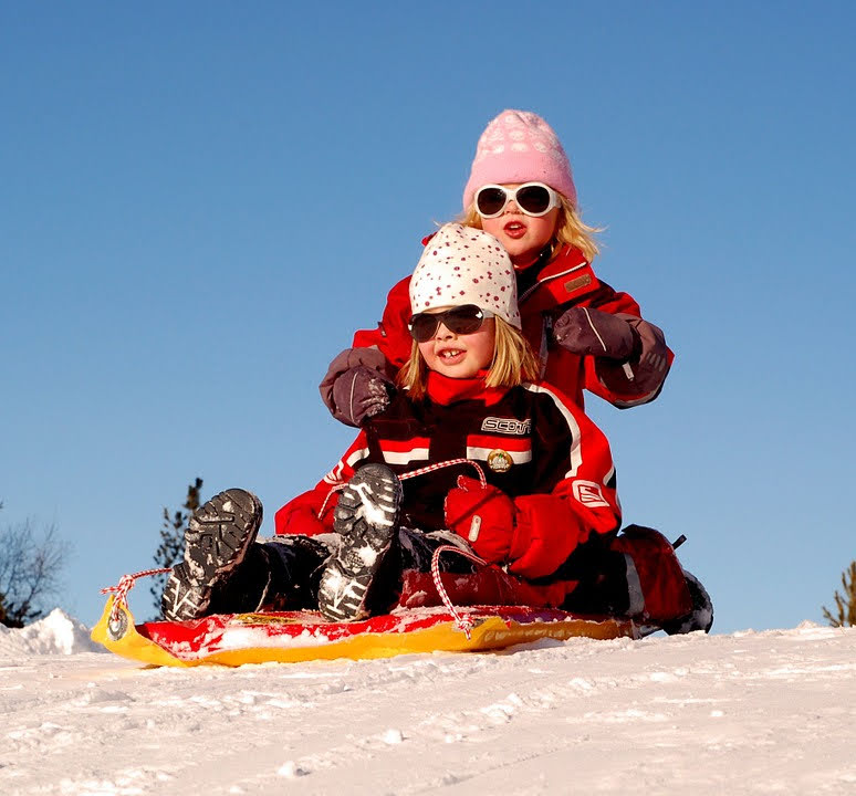 Kids sledding. The Hazards Of 3 Popular Winter Sports.