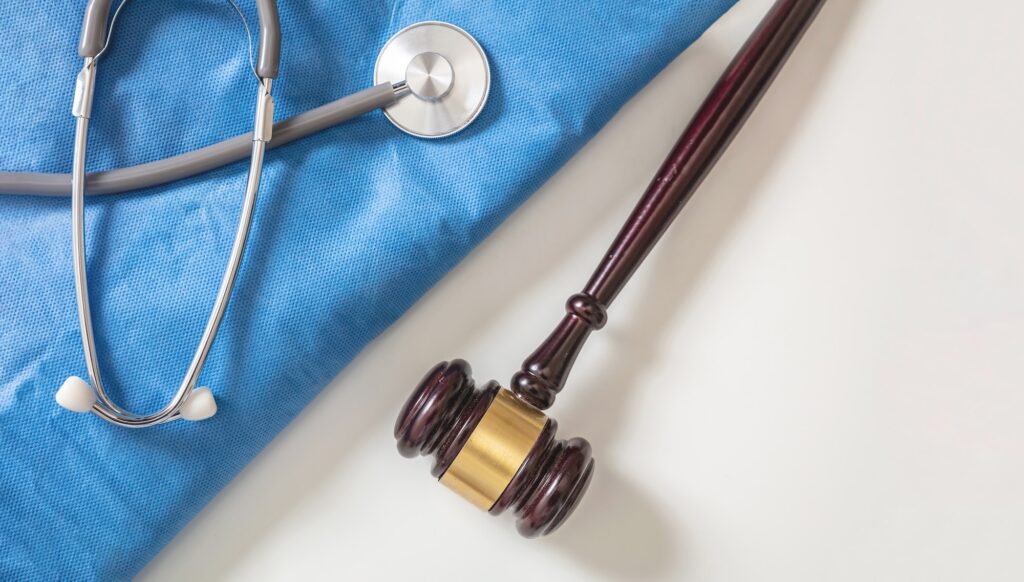 Personal Injury Lawyer In Des Peres Missouri. Doctor equipment and a judge gavel.