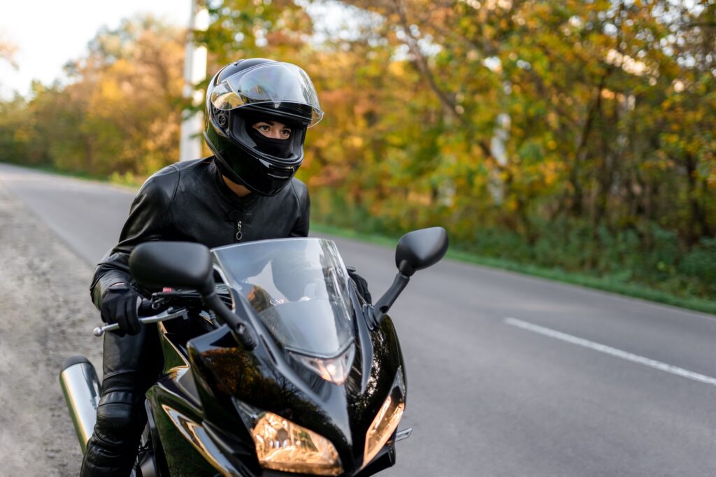 Young girl on a sports motorcycle